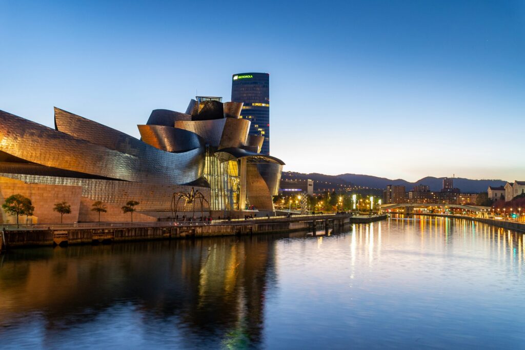 The Guggenheim Museum Bilbao, a large modern building beside the river